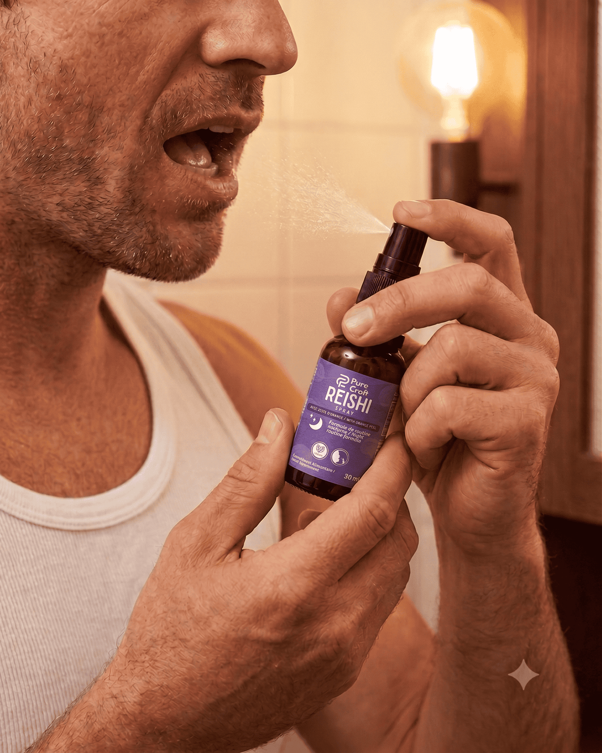 Man using Reishi spray with orange peel for night routine, functional mushroom supplement