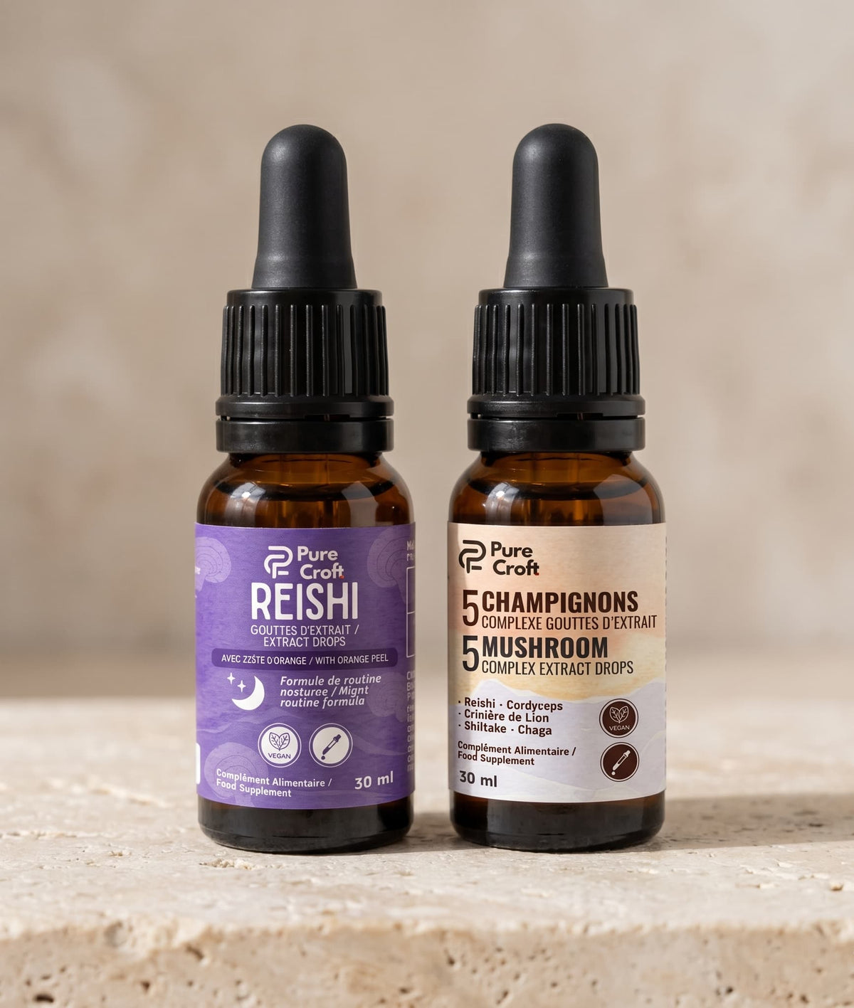 Reishi and 5 Mushroom extract drops in amber glass bottles with droppers, vegan food supplements